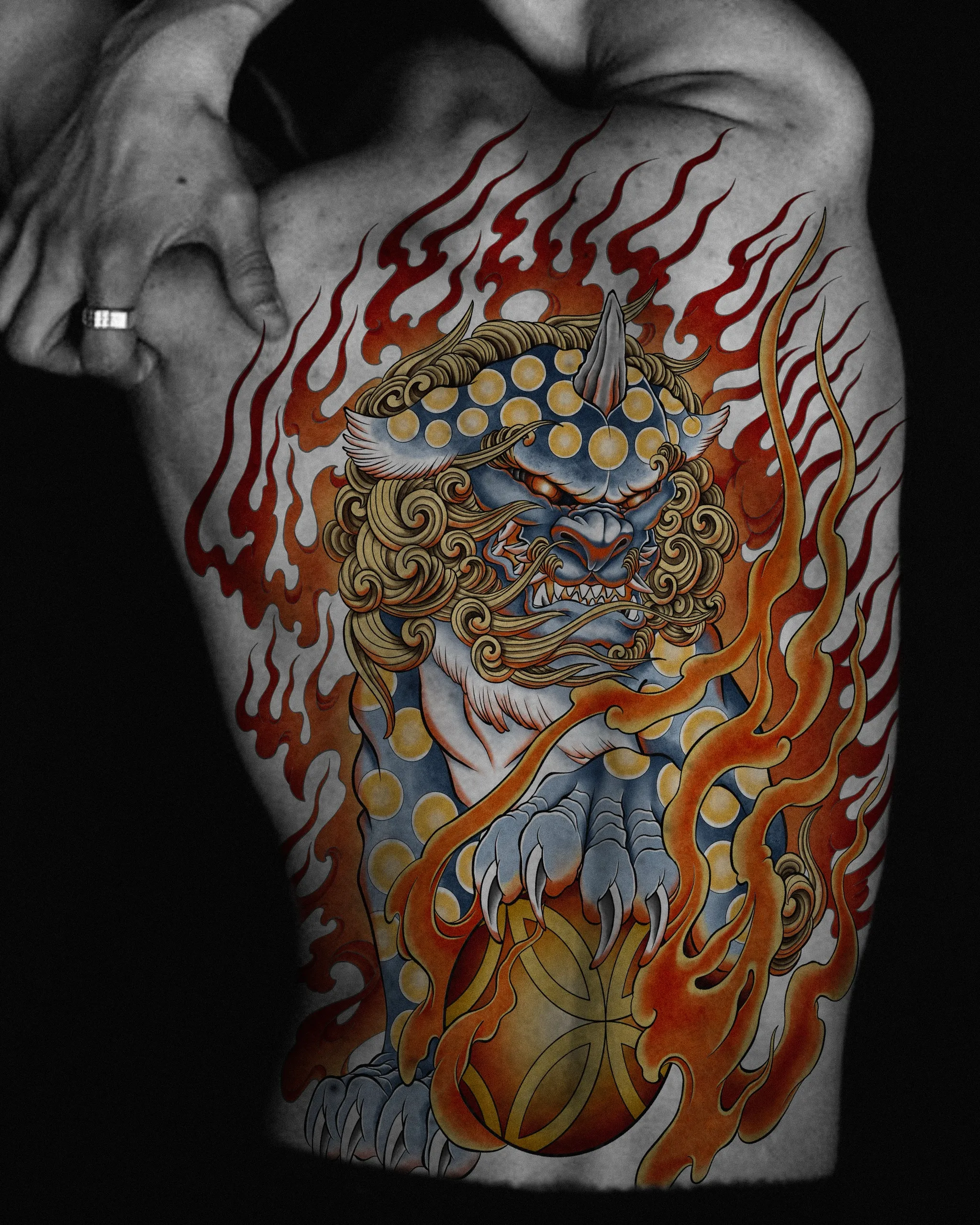 Haetae — a guardian creature tattoo with flowing mane and flames