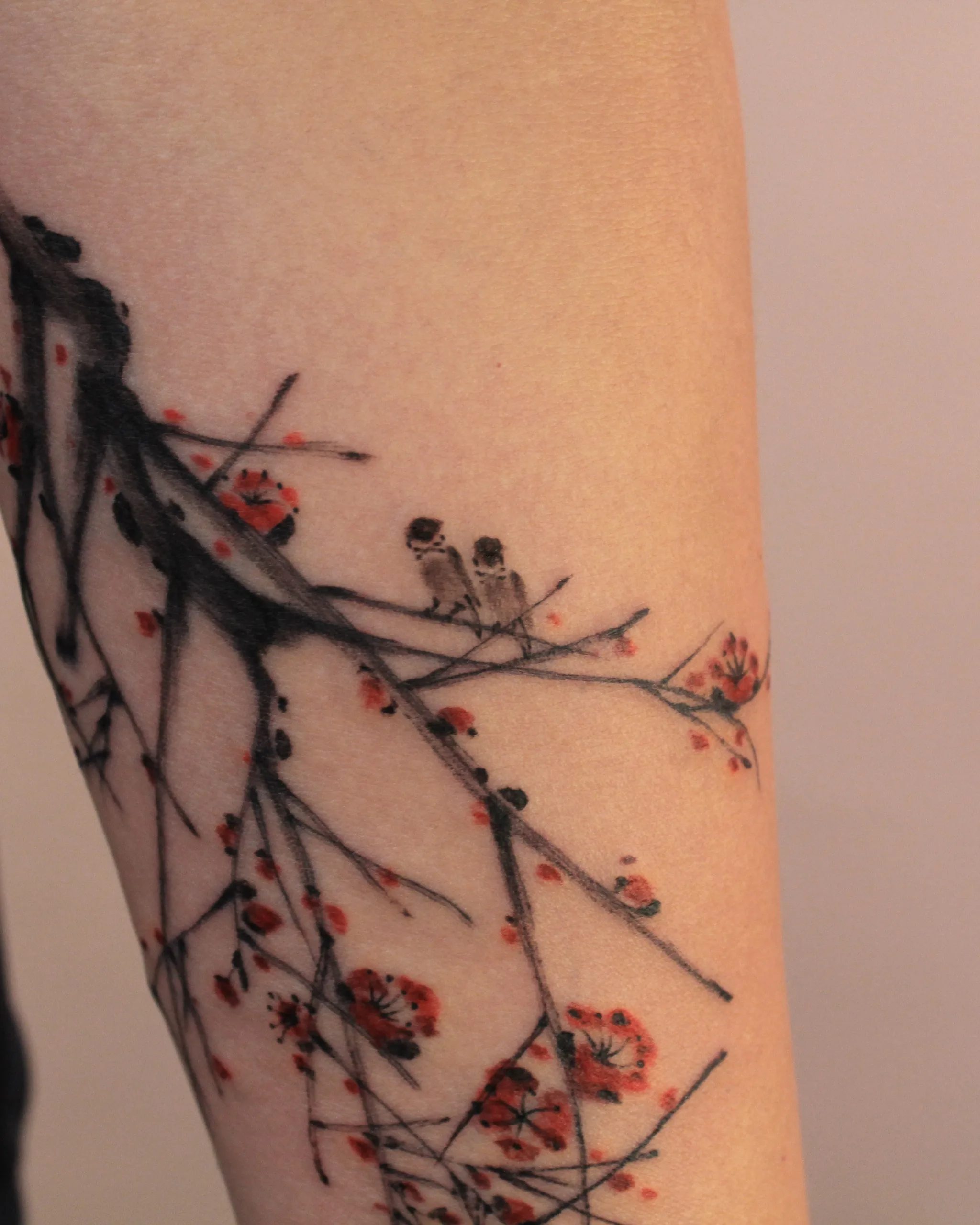 Sparrow & Plum Blossom — Sparrow tattoo on skin